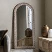 Whitewashed leaner mirror with intricate etching