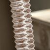 Whitewashed leaner mirror with intricate etching