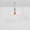 A chic, early century inspired LED pendant with translucent opal globes