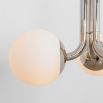 A chic, early century inspired LED pendant with translucent opal globes