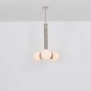 A glamorous polished nickel ceiling pendant inspired by early century and industrial style 