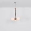 A glamorous polished nickel ceiling pendant inspired by early century and industrial style 
