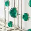 A stylish polished nickel console with emerald acrylic cabochons and marble top