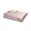 A luxury bedspread by Gingerlily with a vintage pink design and stylish stitched details