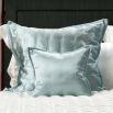 A stylish teal-toned luxury silk cushion