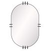 Gently rounded mirror framed in a thin band of bronze iron metal with prongs