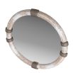Lime-washed wooden mirror punctuated with bands of bronzed brass