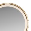 Round mirror framed in antique brass and wrapped in stitched ivory leather