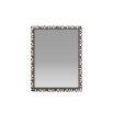 Delicate mosaic of black and white resin adorn a rectangular mirror