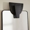 Sleek rectangular mirror with thin black frame and copperhead accent
