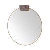 Slim round mirror with jewellery like detail at its top