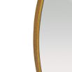 Slim round mirror with jewellery like detail at its top