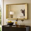 Rectangular mirror with antique brass frame featuring wave detailing