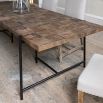 Elegant, industrial-inspired dining table with cubed wood finish and iron legs