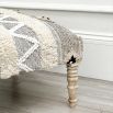 A stylish Aztec stool crafted from cotton, wool and mango wood