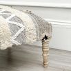 A stylish Aztec stool crafted from cotton, wool and mango wood