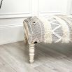 A stylish Aztec stool crafted from cotton, wool and mango wood