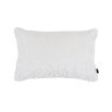 A luxury, white velvet cushion with stylish undulating waves