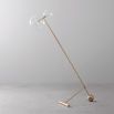 Natural brass industrial style floor lamp with angled design and clear glass globe lampshades with adjustable height