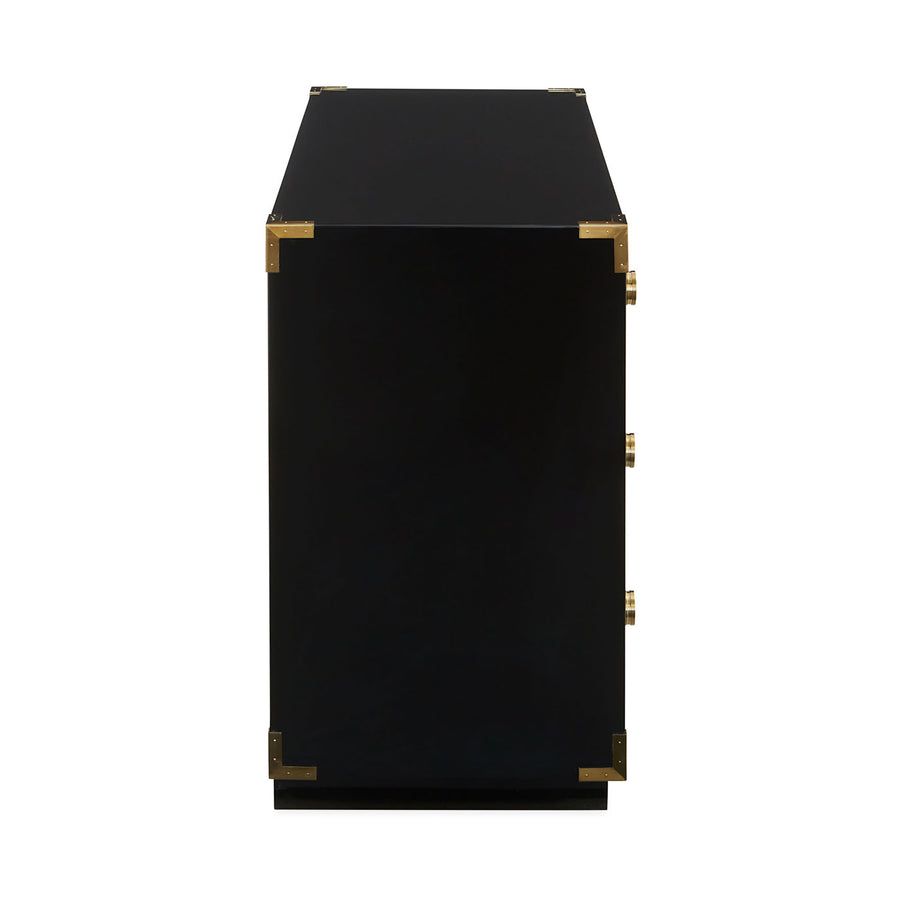 Black three-drawer chest with eclectic gold decorative elements