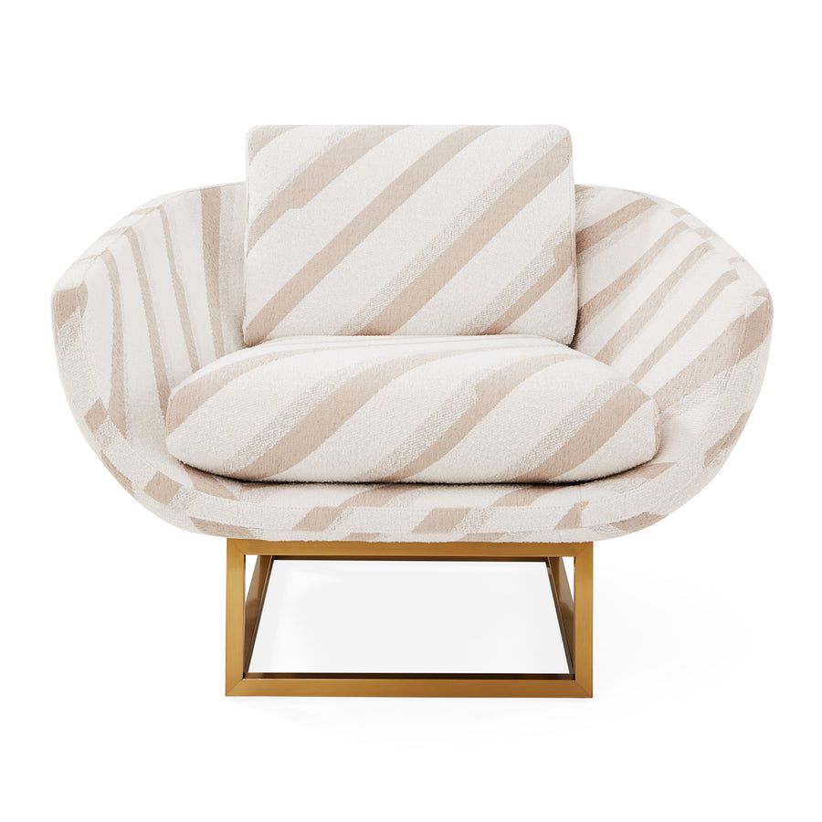 The Beaumont Lounge Chair combines minimalist design with luxurious comfort, featuring a sculptural brass base and elegant upholstery in velvet or bouclé.