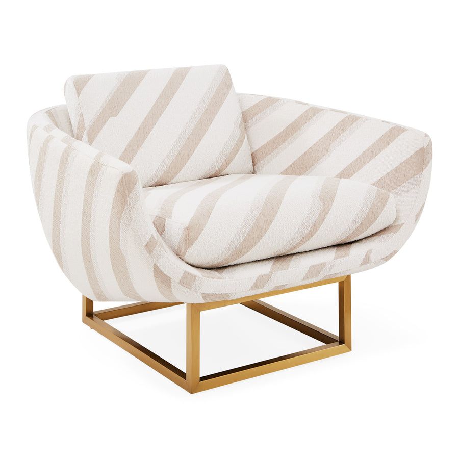 The Beaumont Lounge Chair combines minimalist design with luxurious comfort, featuring a sculptural brass base and elegant upholstery in velvet or bouclé.