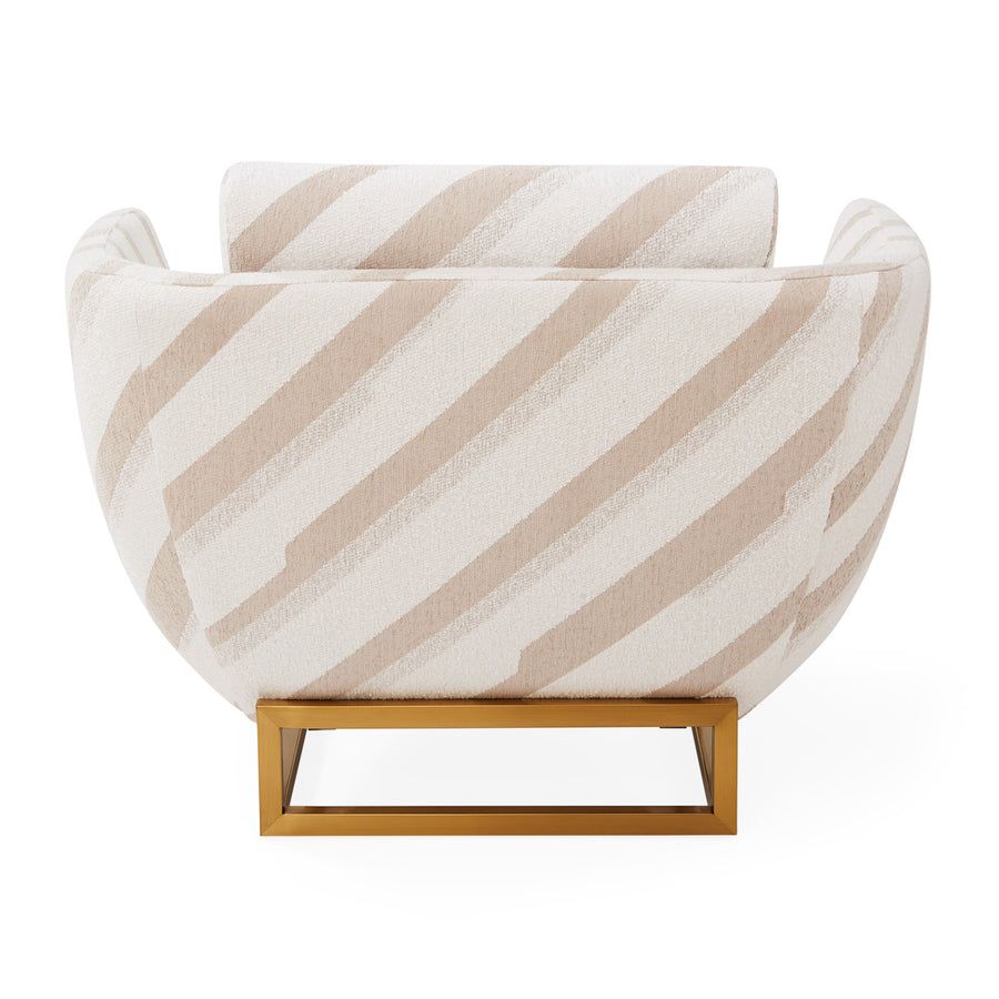 The Beaumont Lounge Chair combines minimalist design with luxurious comfort, featuring a sculptural brass base and elegant upholstery in velvet or bouclé.