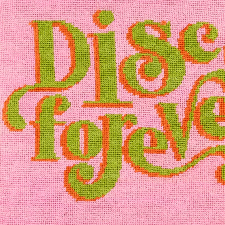 A hand-embroidered cushion with playful, retro-inspired bumper sticker sentiments, crafted with couture materials and velvet backing.