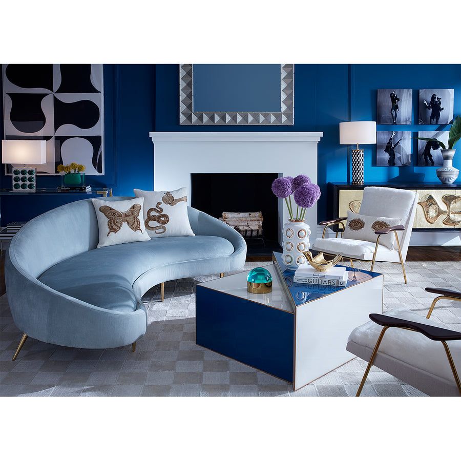 Curved pale blue sofa in boucle finish