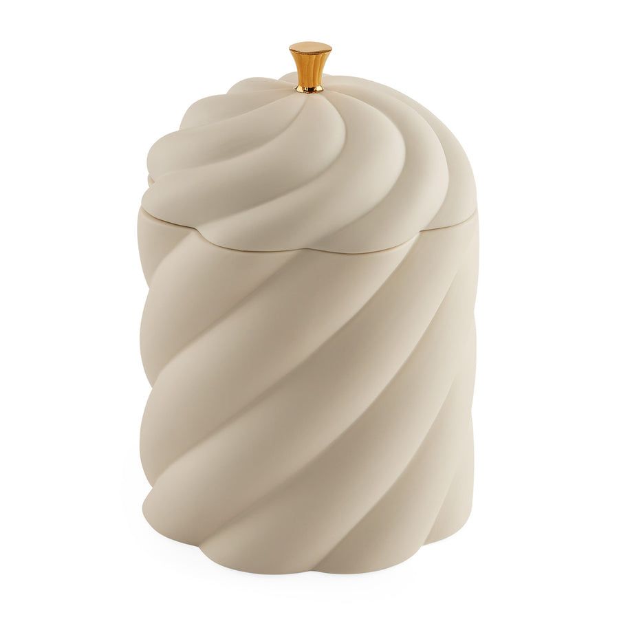 A sculptural, high-fired porcelain box with a luxe gold pull, perfect for adding elegance to any table or space.