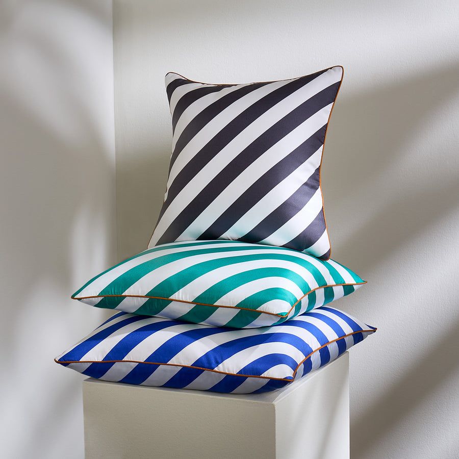 The Cabana Cushion features classic stripes printed on luxurious silk, adding a prep-inspired touch to any pillowscape.