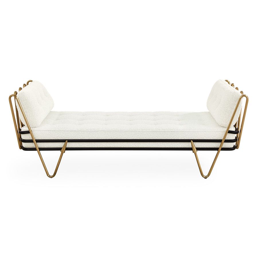 The Maxime Daybed boasts a gleaming brass frame, soft Olympus bouclé cushion, and luxurious details, perfect for lounging, socializing, or accommodating guests.