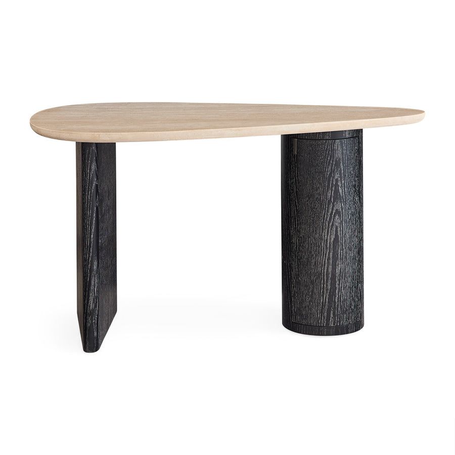 The Oeuf Travertine Desk blends mid century-inspired design with luxe materials, featuring a travertine top, ebonized oak supports, and hidden storage.