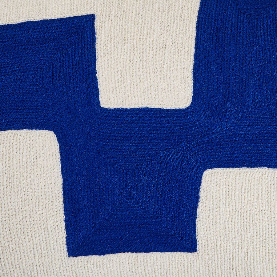Rectangular cushion with blue and white abstract artwork