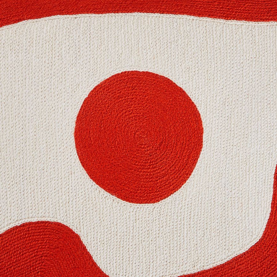 Rectangular cushion with red and white abstract artwork