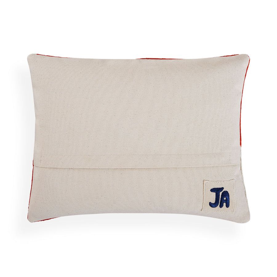 Rectangular cushion with red and white abstract artwork