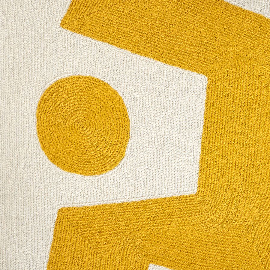 Square cushion with yellow abstract artwork