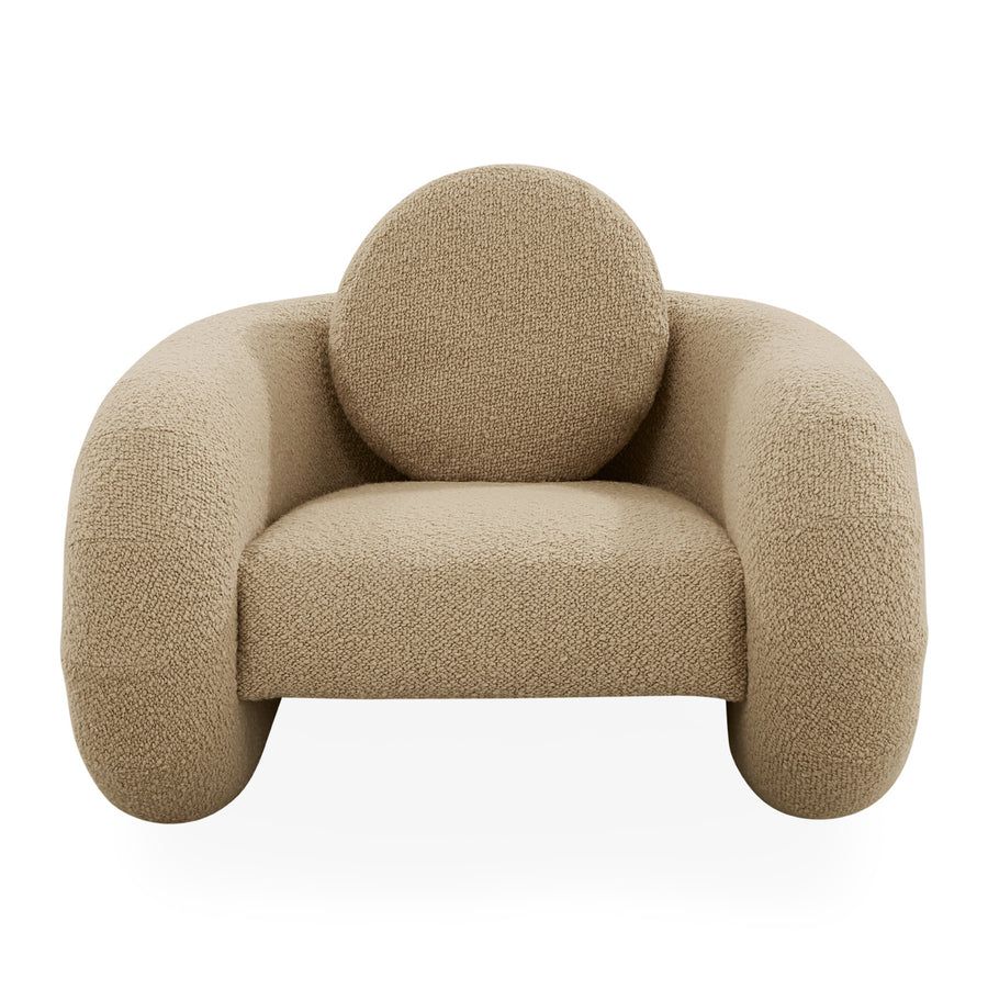 The Pompidou Lounge Chair is a deep, cozy cocoon with a tubular framework, upholstered in Valais Latte bouclé for ultimate comfort.