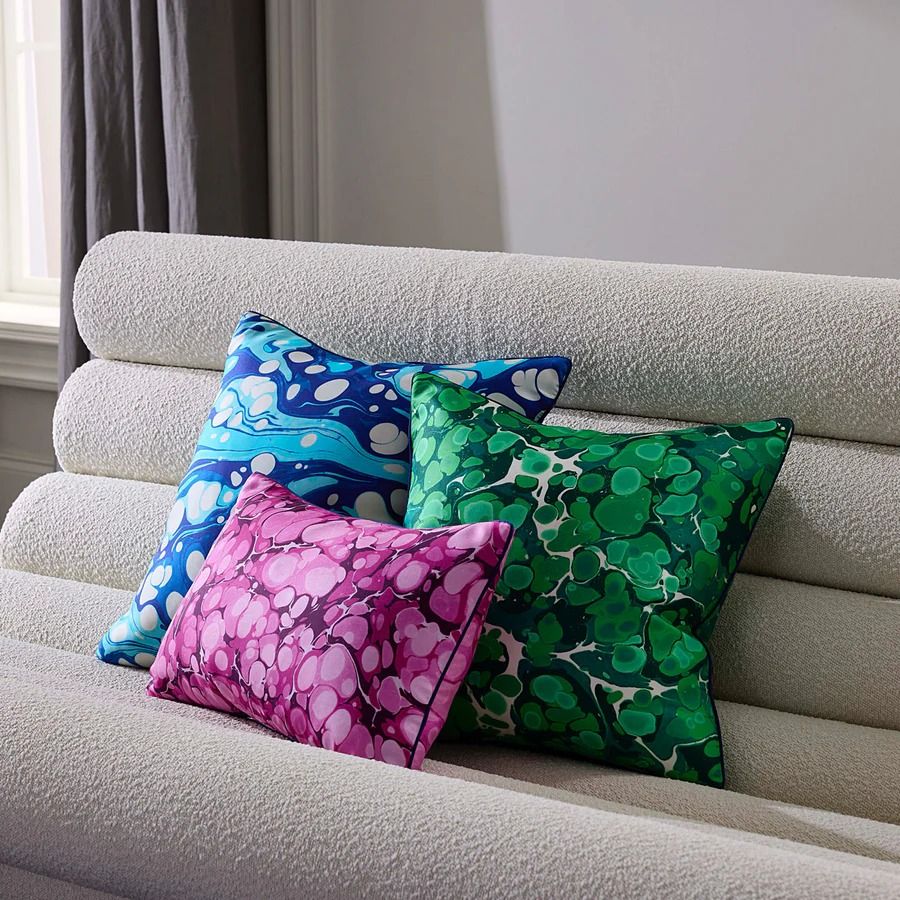 Add a touch of elegance to your space with our Marbleized Fuchsia Silk Cushion. Luxurious, vibrant, and perfect for any decor style.