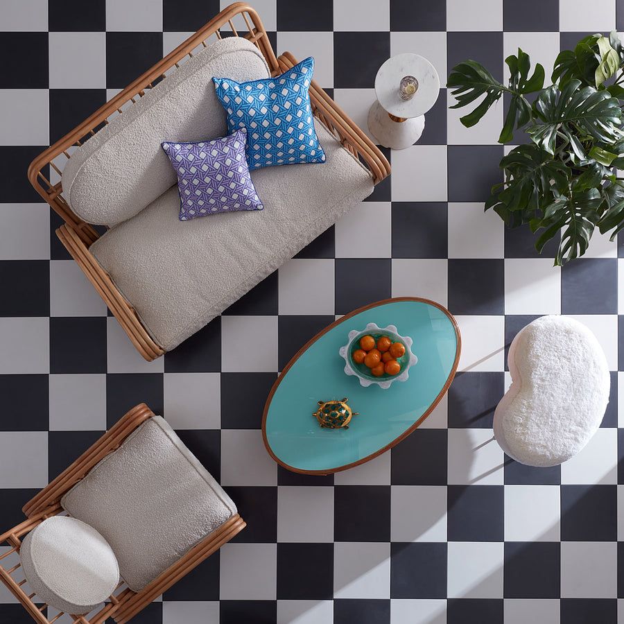 Square cushion with purple diagonal print