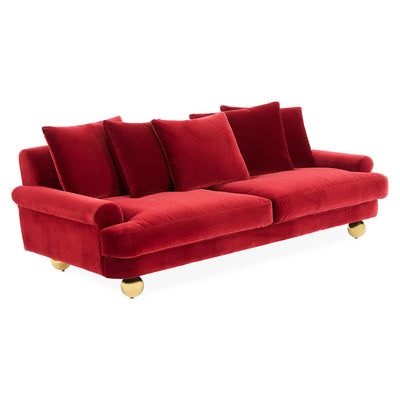 The Greenwich Sofa reimagines classic English design with deep seating, low arms, knife-edged cushions, and oversized brass orb feet.