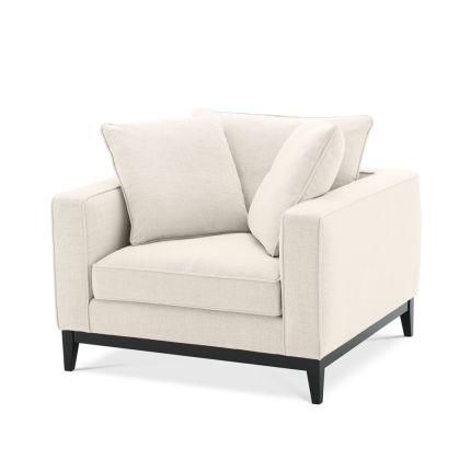 A luxurious minimal beige and black armchair