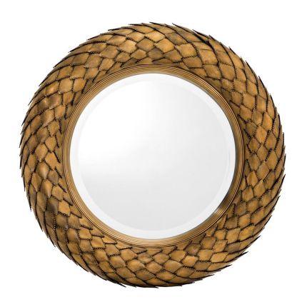A circular mirror with reptilian like scales on frame