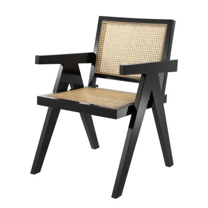 A stylish tropical dining chair with natural cane and black finish 