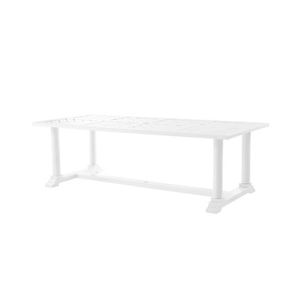 a large rectangular outdoor dining table in white 