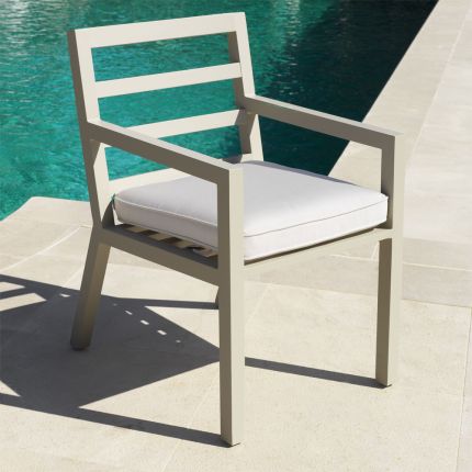 Contemporary sand-toned outdoor dining chair with neutral seat cushion by Eichholtz