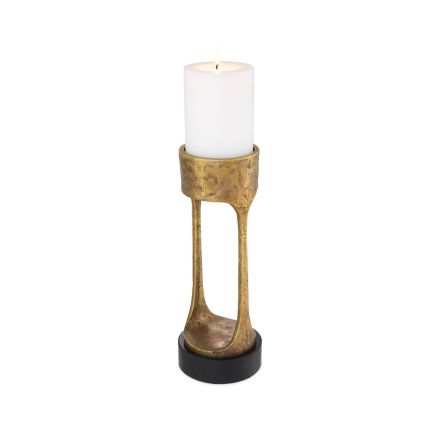 An antique brass vintage candle holder
