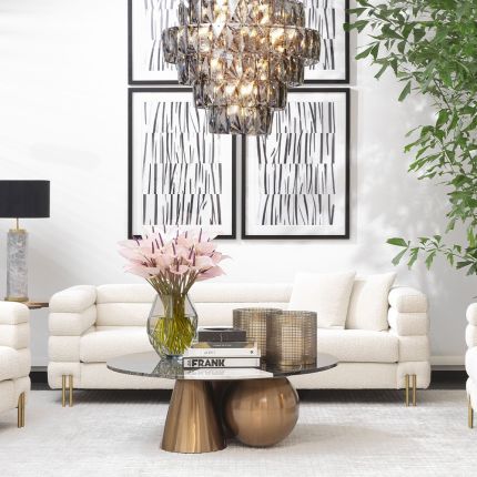 A luxurious sofa by Eichholtz with Art Deco undertones and glamorous golden feet
