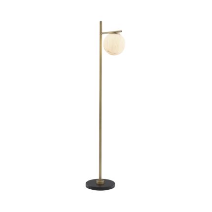 Luxurious antique brass floor lamp with alabaster lampshade on a black marble base