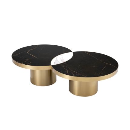 Black and white marble overlapping coffee table with eclipse-like detail and brass base